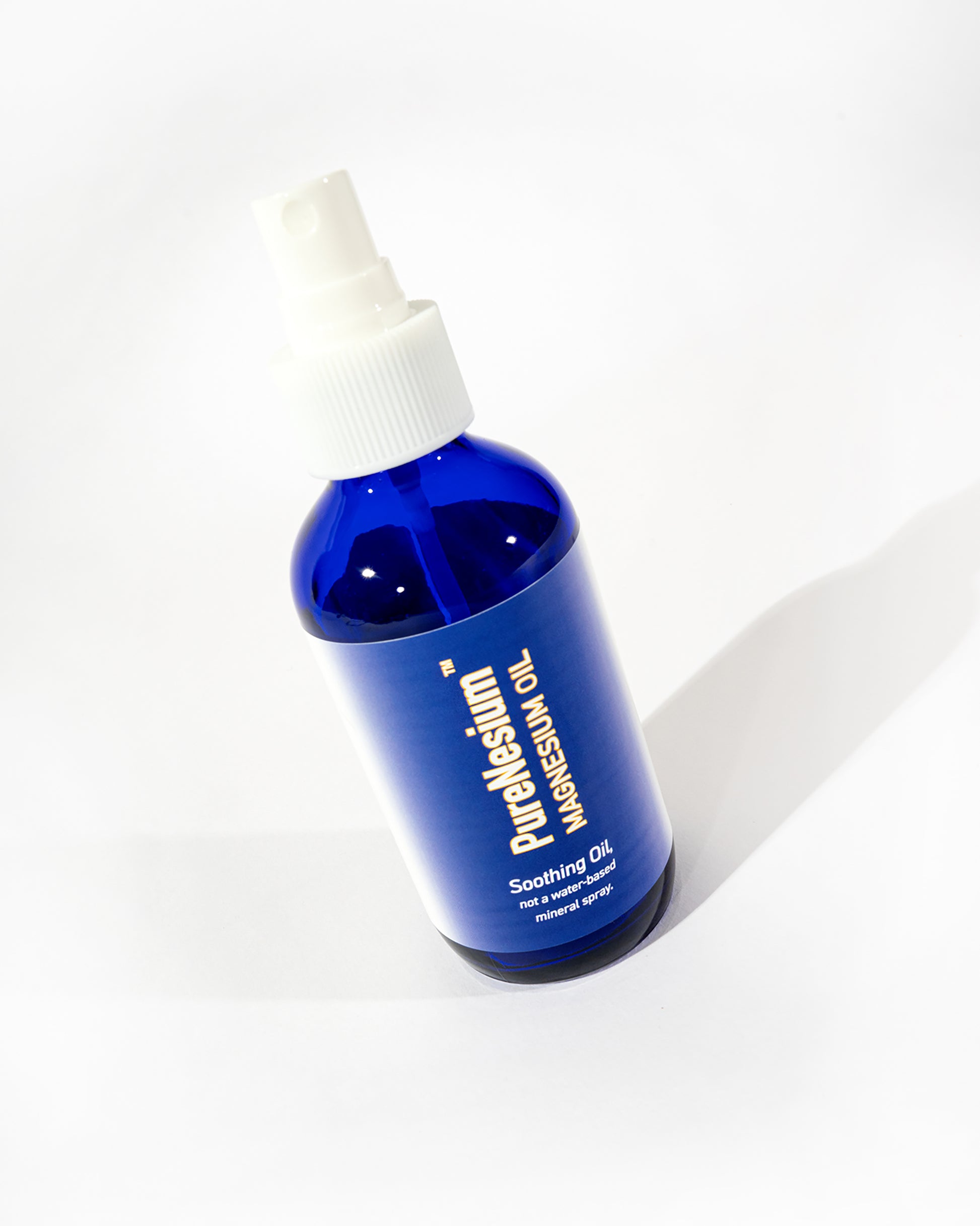 PureNesium Topical Magnesium Oil - angled bottle shot
