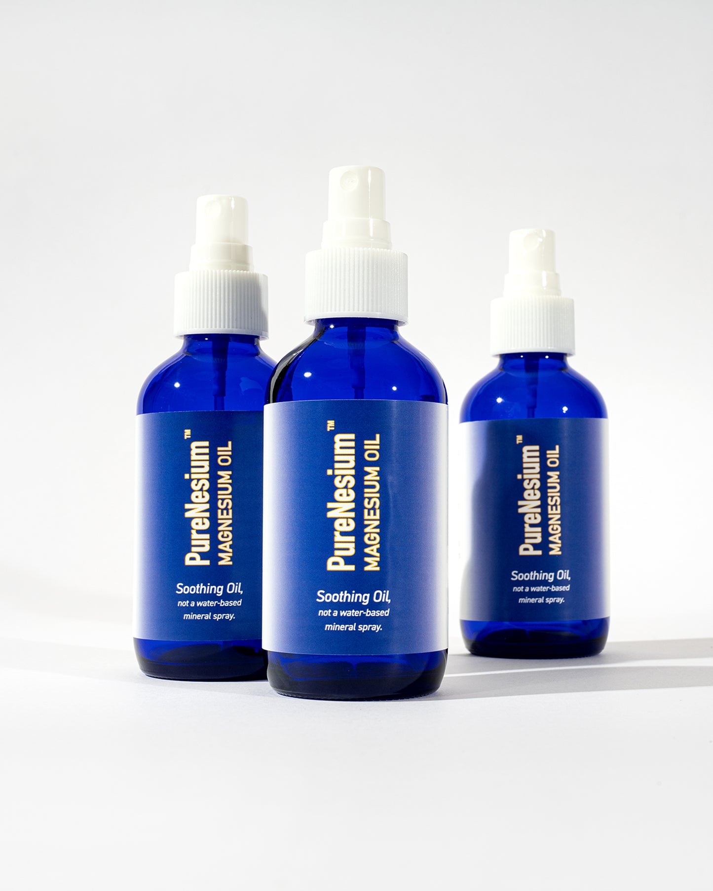 PureNesium Topical Magnesium Oil - three bottles group shot